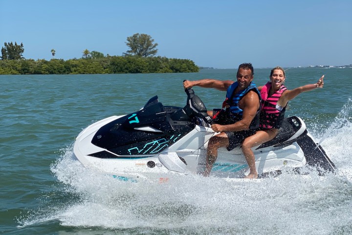 a man riding a wave on top of a body of water